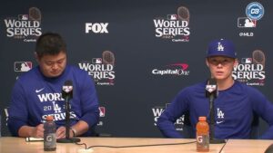 World Series 2024 team captains at a press conference, sitting side by side with microphones in front of them, discussing the upcoming match." 